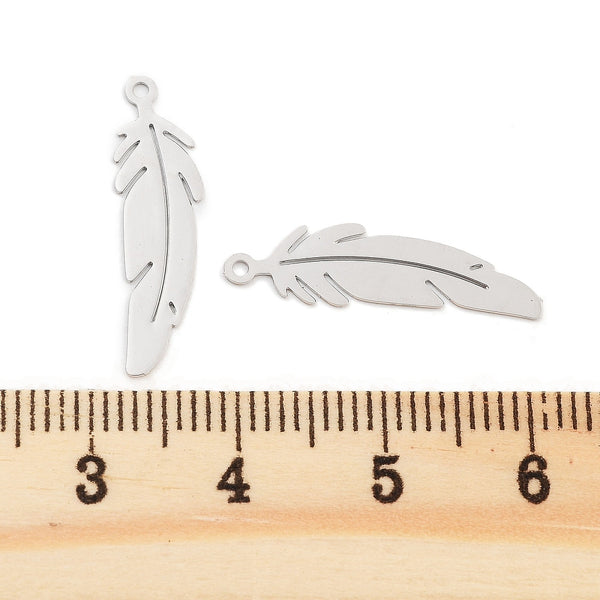 Platinum feather charms x 8 pieces