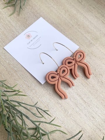 Rusty orange bow hoops