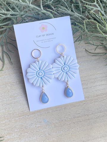 Blue flower with blue teardrop charm