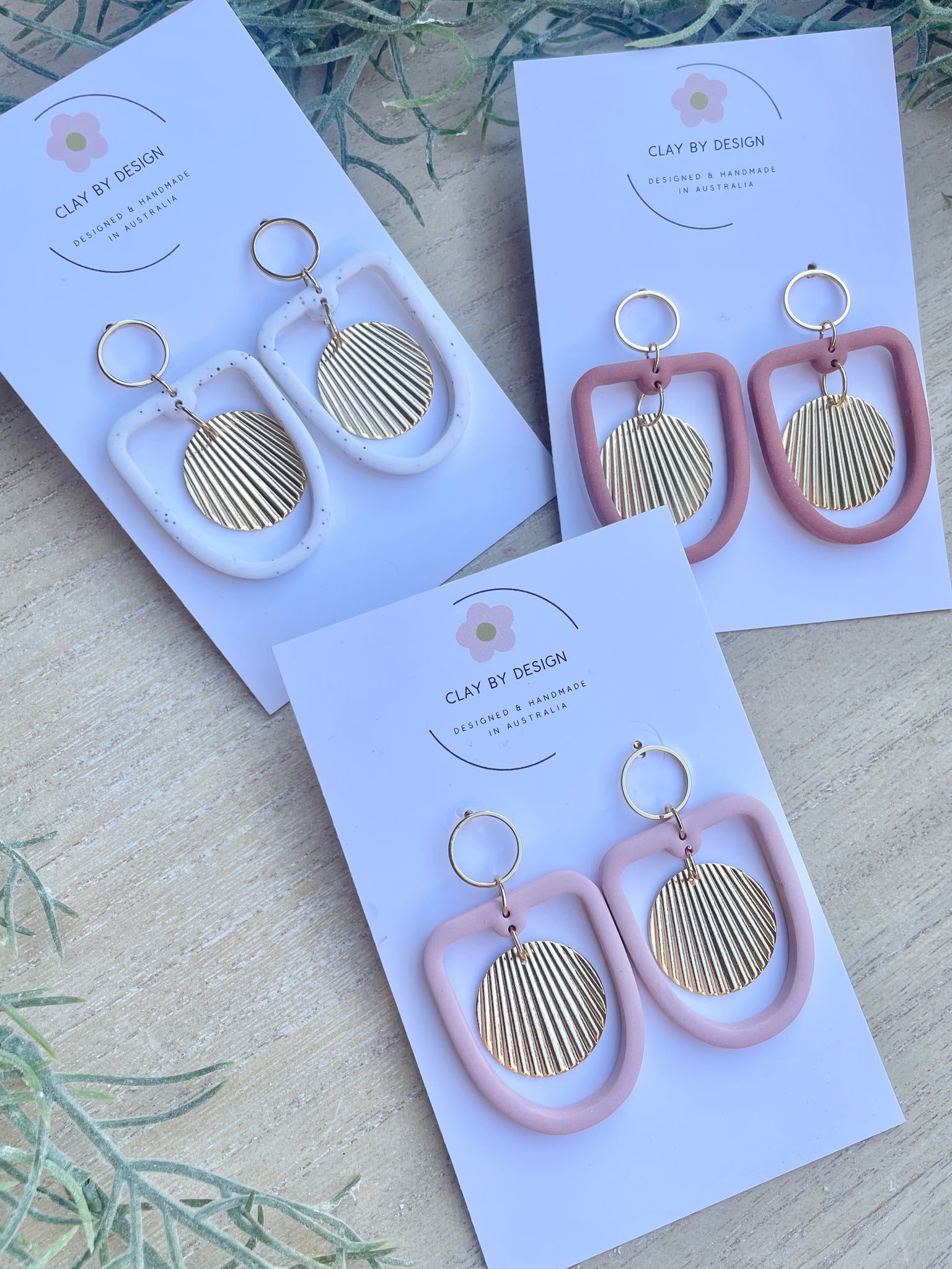 Modern arch dangles with circle charm detail