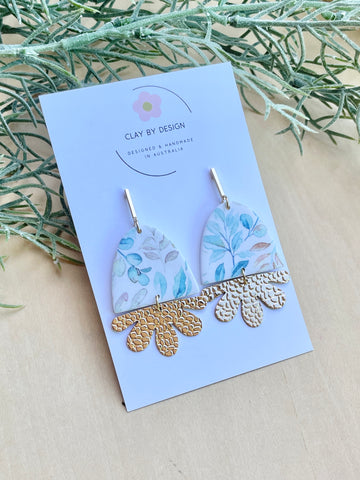 Soft blue leaf arch with gold plated flower charms