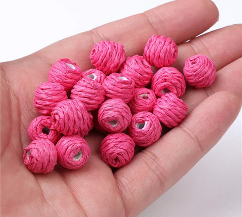 Magenta coloured woven raffia beads x 4 pieces