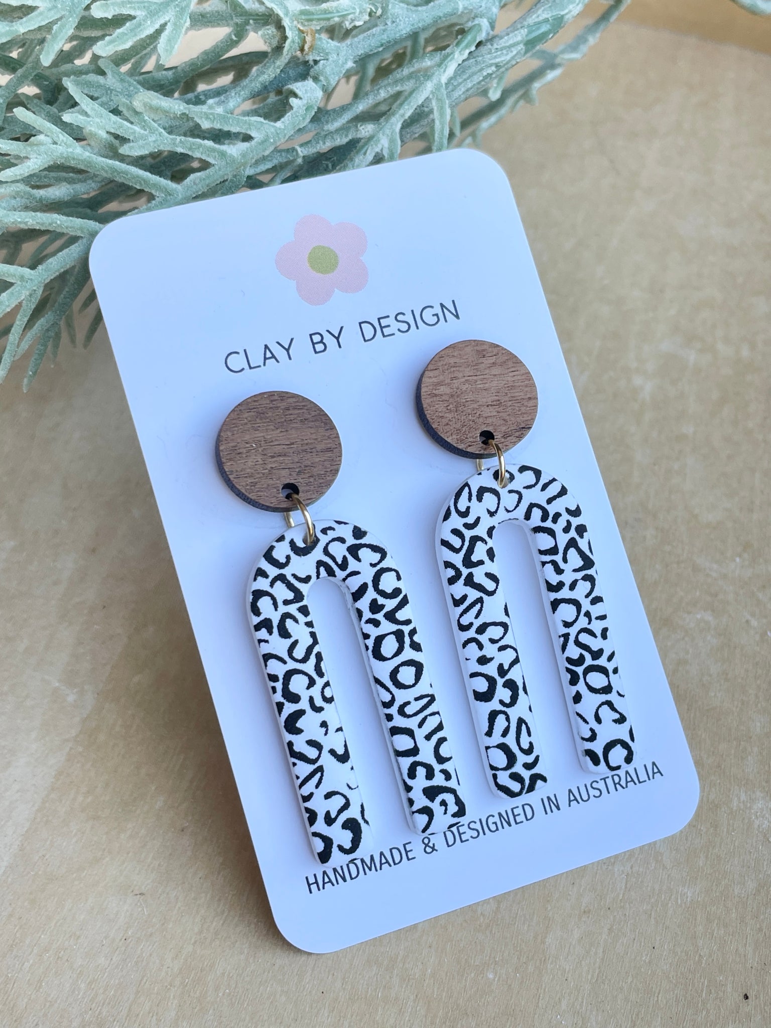 Leopard Arch dangles with wooden stud tops