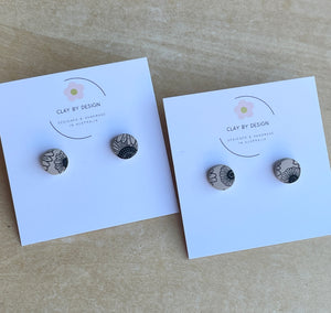 Tan and black flower pattern studs