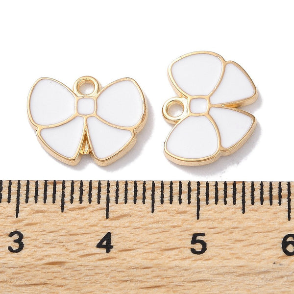 Gold plated bow white charms  x 6