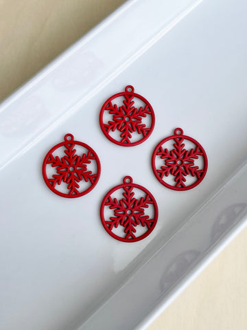 Red snowflake charms x 4