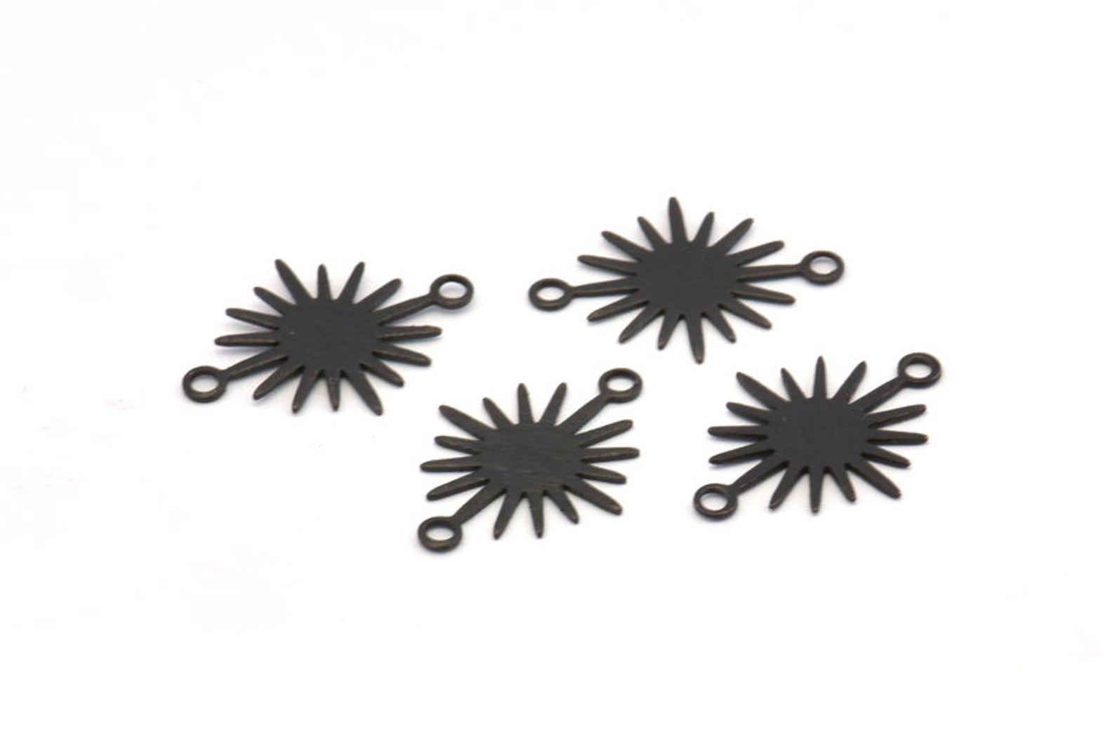 Black oxidised small sun charm/ connectors 1.8cm x 1.3cm x 6 pieces - 2 holes.